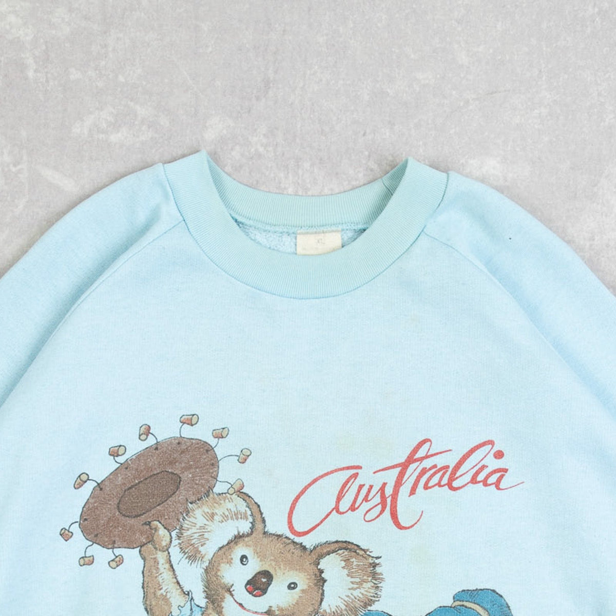 MEN'S VINTAGE 1980S AUSTRALIA RAGLAN SWEATSHIRT - X-LARGE