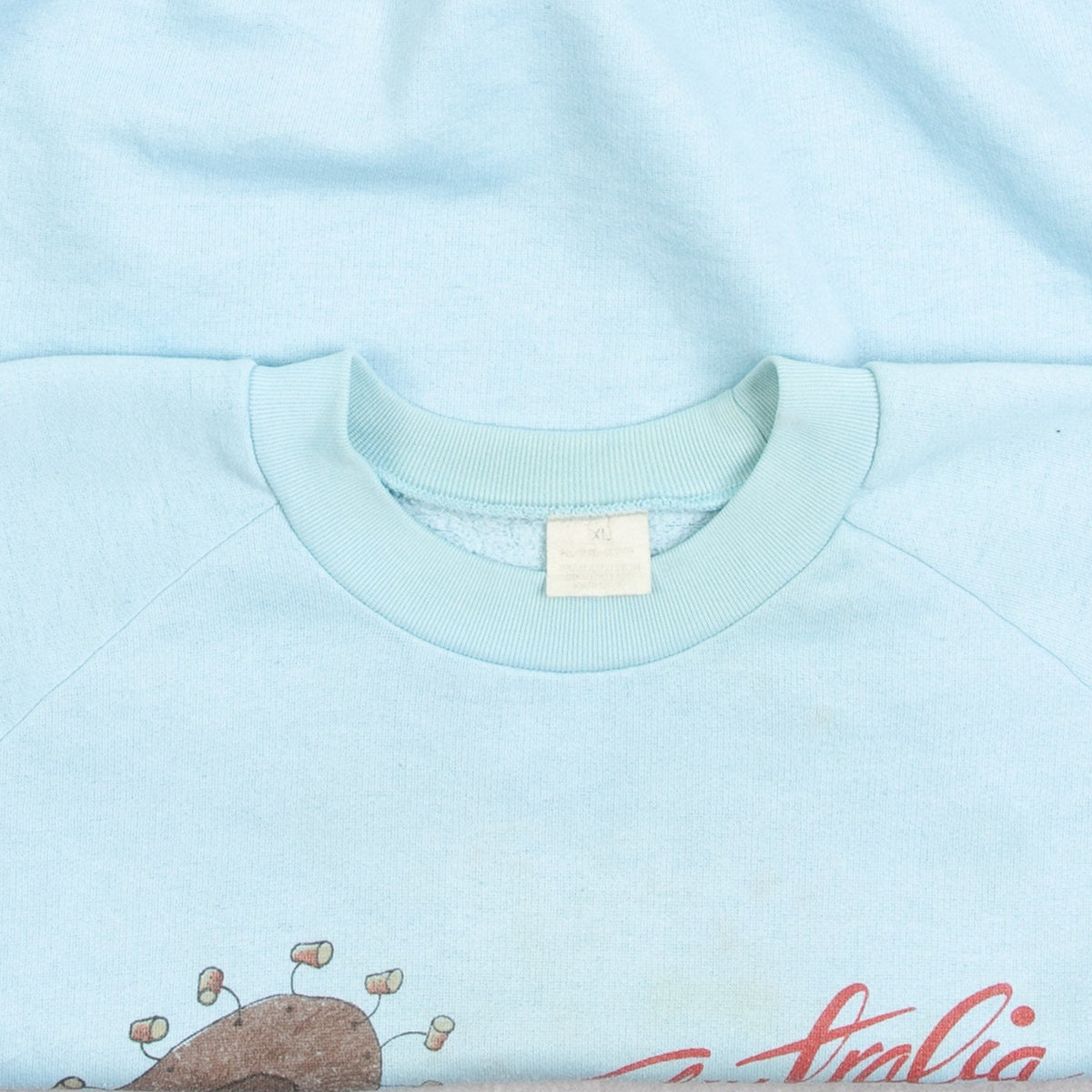 MEN'S VINTAGE 1980S AUSTRALIA RAGLAN SWEATSHIRT - X-LARGE