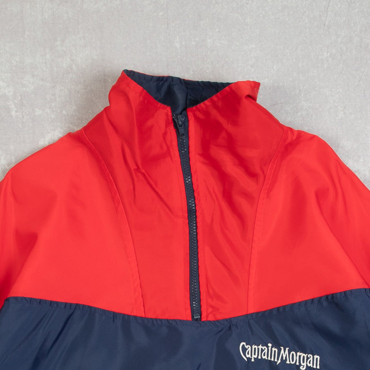 MEN'S VINTAGE 1980S CAPTAIN MORGAN PULLOVER WINDBREAKER JACKET - MEDIUM